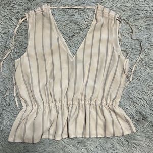 Delicate cinched peplum top